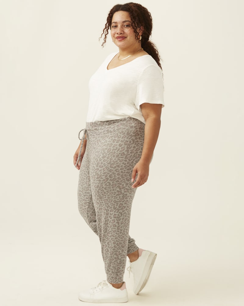 Plus size model with pear body shape wearing Ava Leopard Print Jogger by Beyond Yoga | Dia&Co | dia_product_style_image_id:193534
